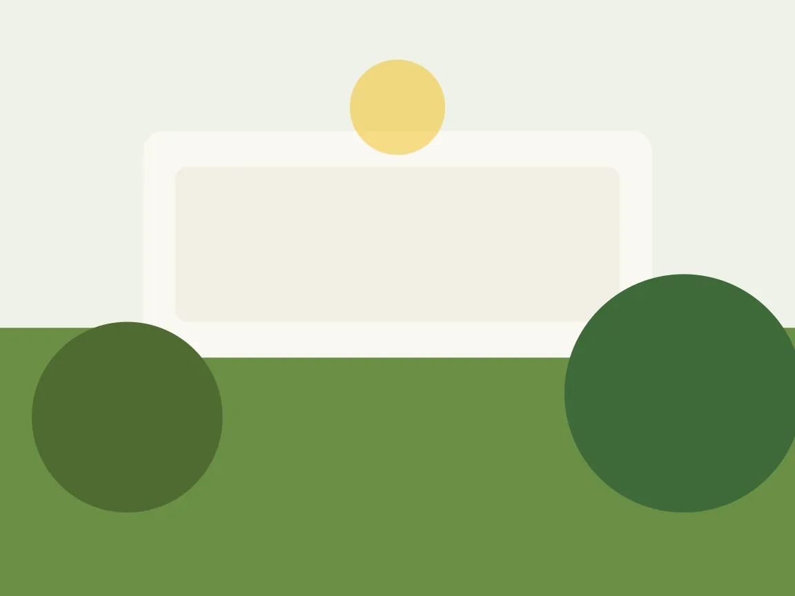 Wooden table under tropical vegetation with natural light filtering through the leaves
